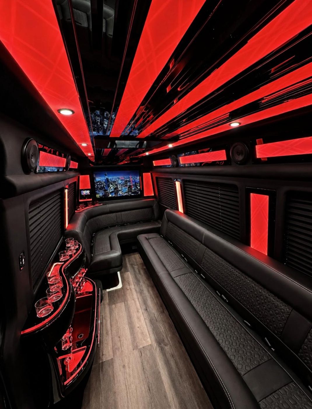 Inside the M&M Legacy Sprinter: leather lounge seating under a lit ceiling